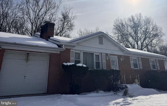 single story home featuring a garage