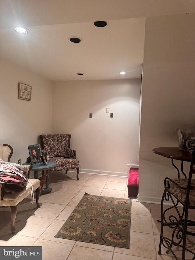 living area featuring light tile patterned floors