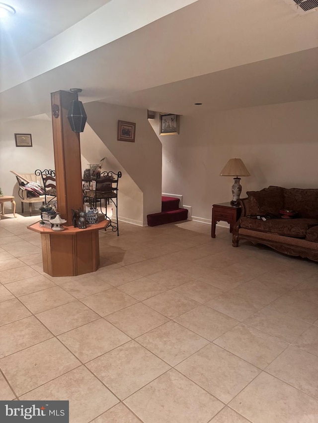 tiled living room with vaulted ceiling