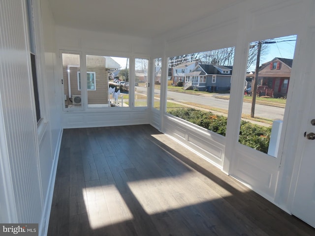 unfurnished sunroom with plenty of natural light