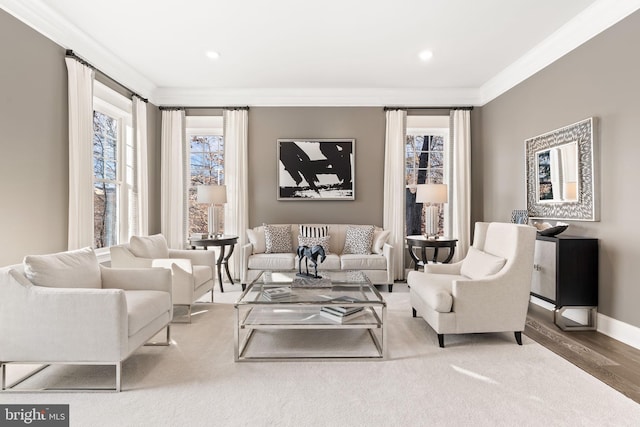 living room with hardwood / wood-style flooring and ornamental molding