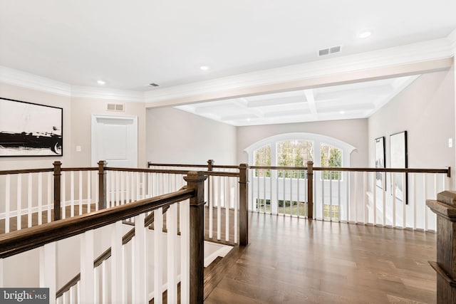 hall with coffered ceiling, beam ceiling, crown molding, and wood-type flooring