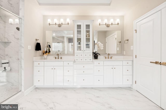 bathroom with vanity and a shower with shower door