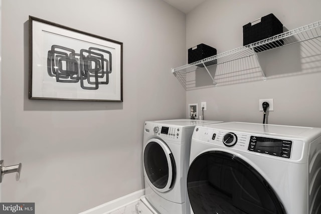 laundry room with independent washer and dryer