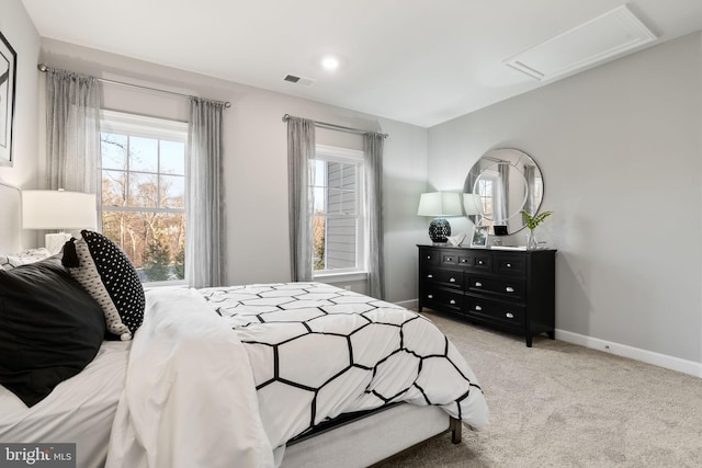 bedroom featuring light colored carpet