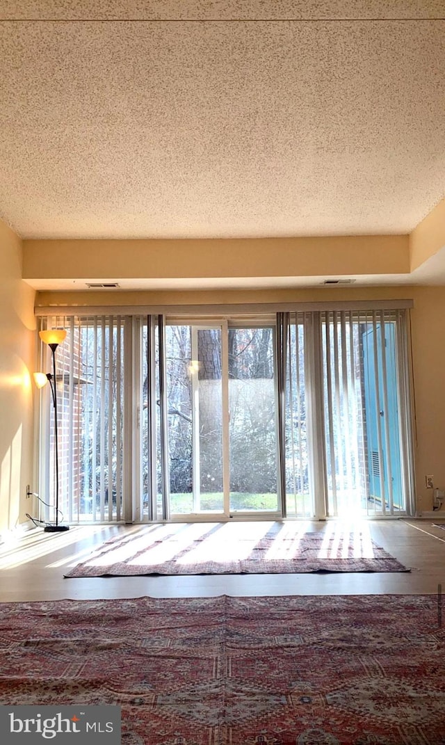 interior space featuring a textured ceiling