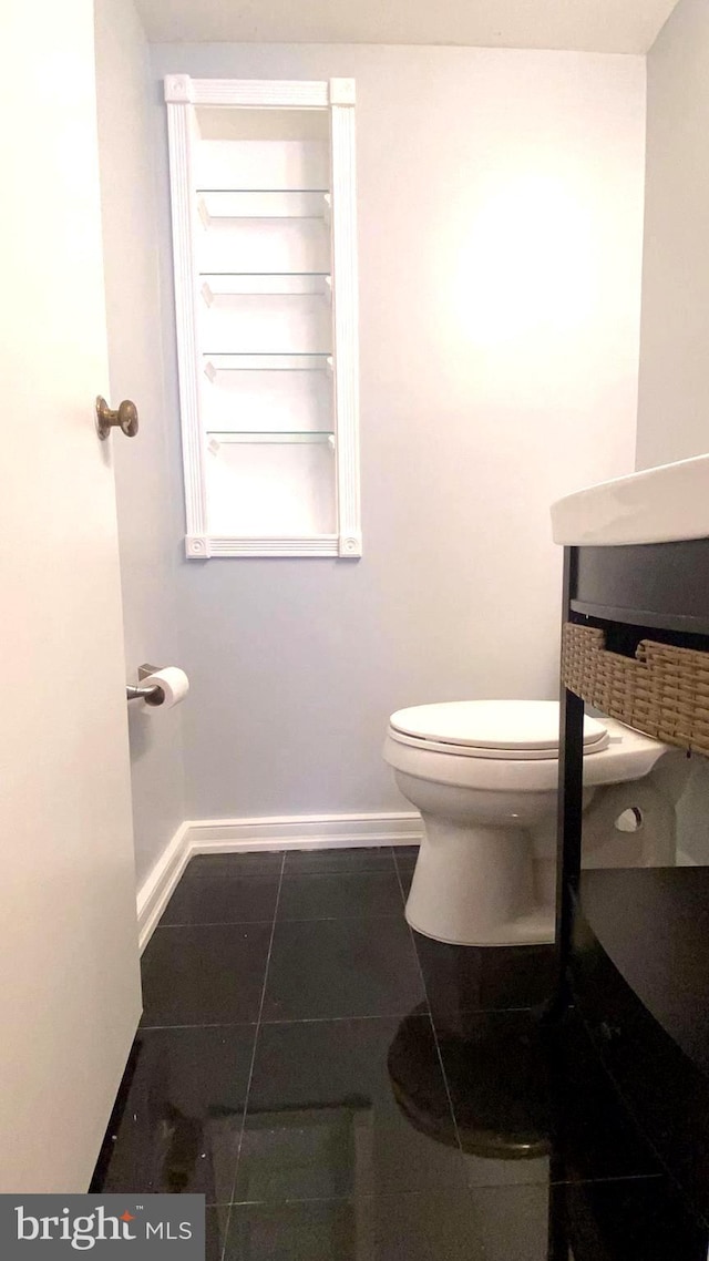 bathroom with tile patterned floors and toilet