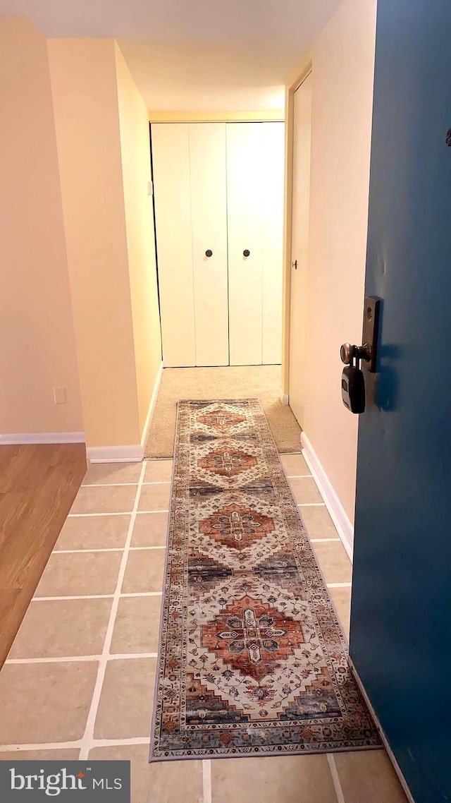 hallway with light tile patterned flooring