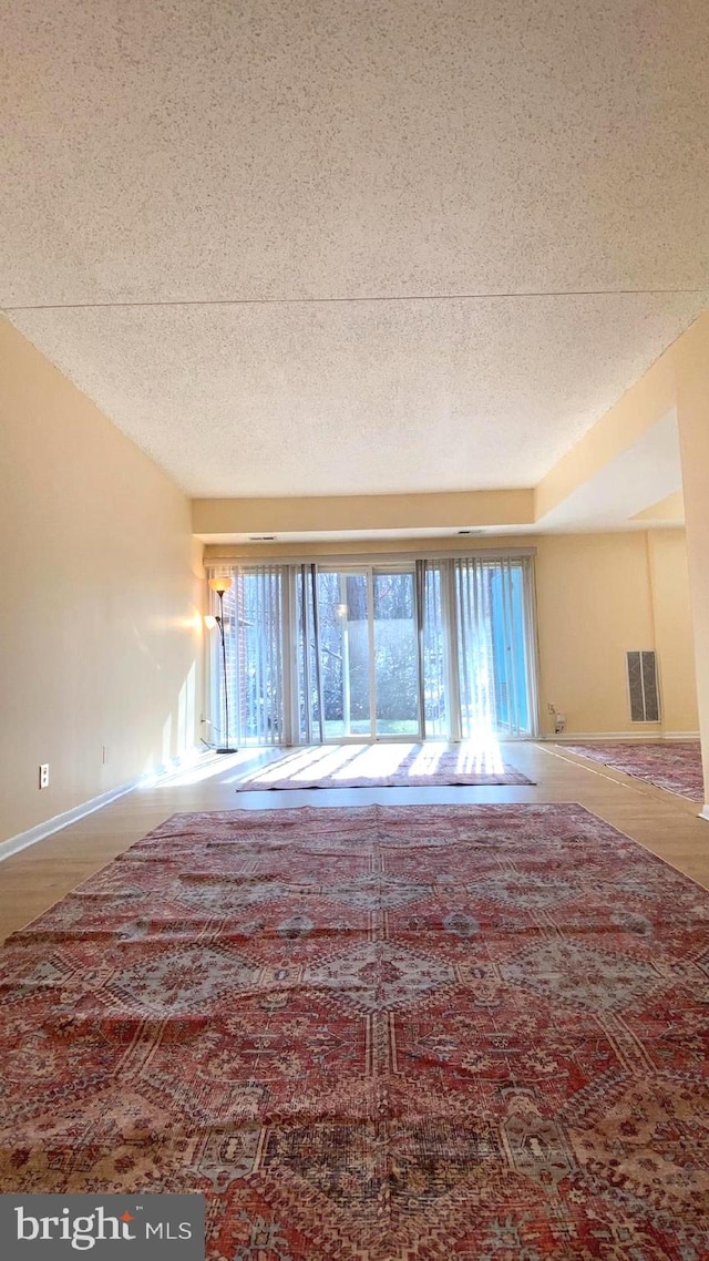 spare room with a healthy amount of sunlight and a textured ceiling