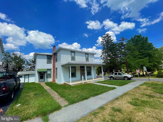 view of front of house featuring covered porch and a front yard