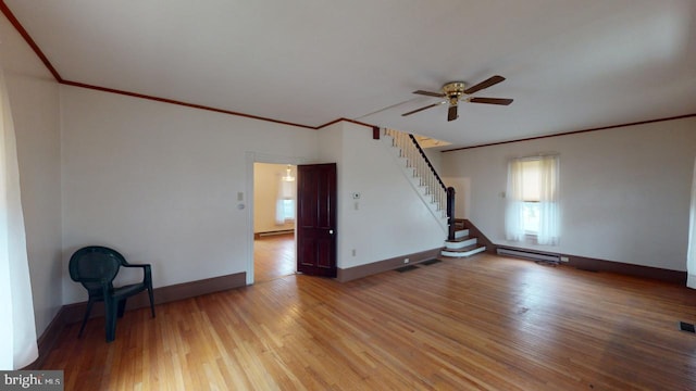 unfurnished room featuring wood-type flooring, ornamental molding, ceiling fan, and a baseboard radiator