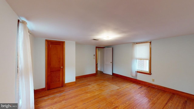 unfurnished bedroom featuring light wood-type flooring