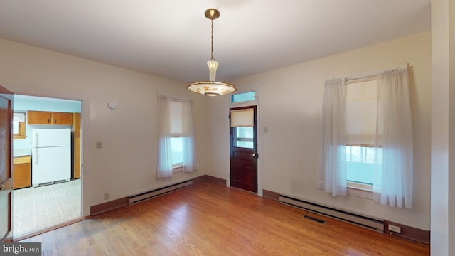 interior space featuring a baseboard radiator and light wood-type flooring