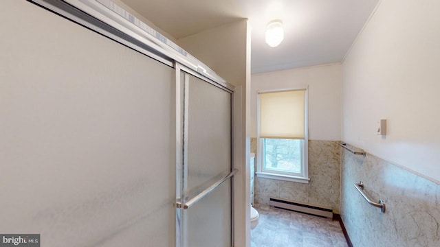 bathroom with toilet, a baseboard heating unit, and walk in shower