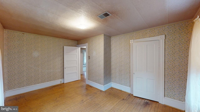 unfurnished bedroom featuring hardwood / wood-style flooring