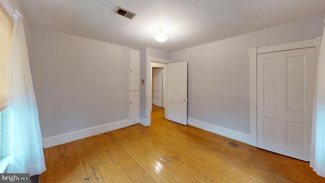 unfurnished bedroom featuring hardwood / wood-style floors