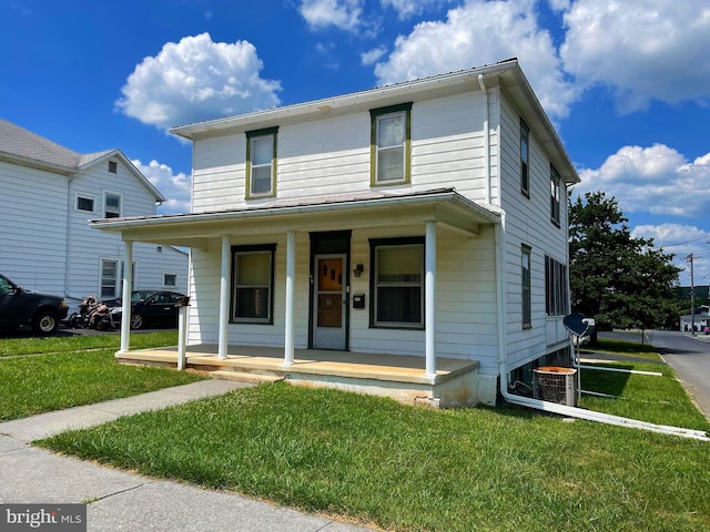 view of front property with a porch and a front yard