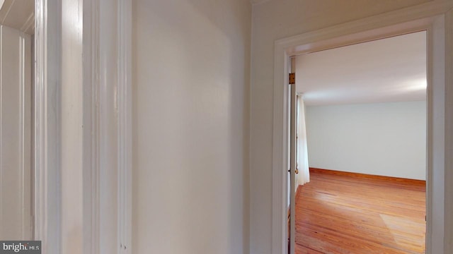 corridor with light wood-type flooring