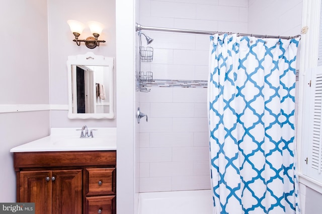 bathroom with vanity and a shower with shower curtain