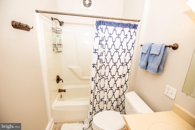 full bathroom with shower / tub combo, vanity, and toilet