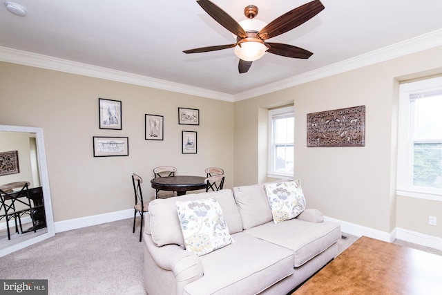 living room featuring crown molding, light carpet, and ceiling fan