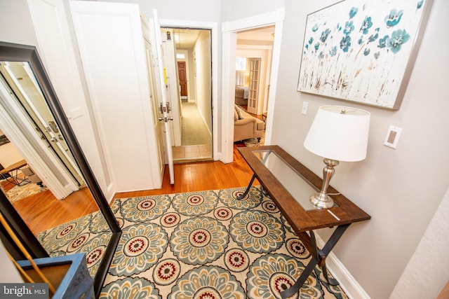 hallway with light wood-type flooring