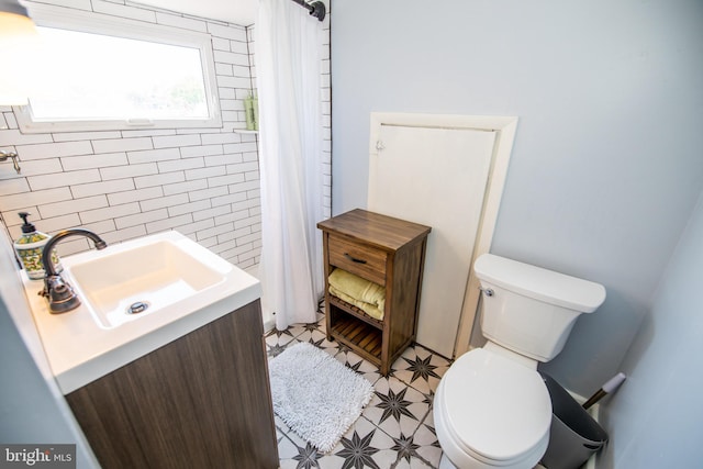 bathroom with vanity, a shower with curtain, and toilet