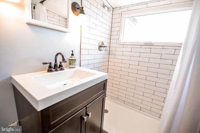 bathroom with vanity and walk in shower