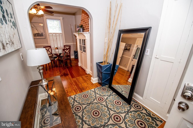 hall with dark hardwood / wood-style floors