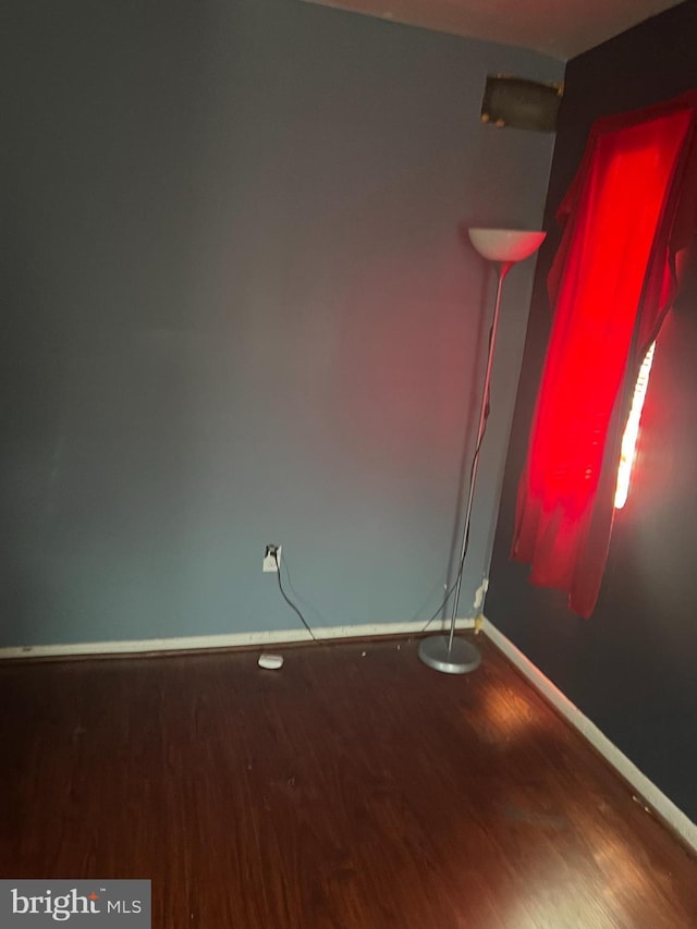 empty room featuring wood-type flooring