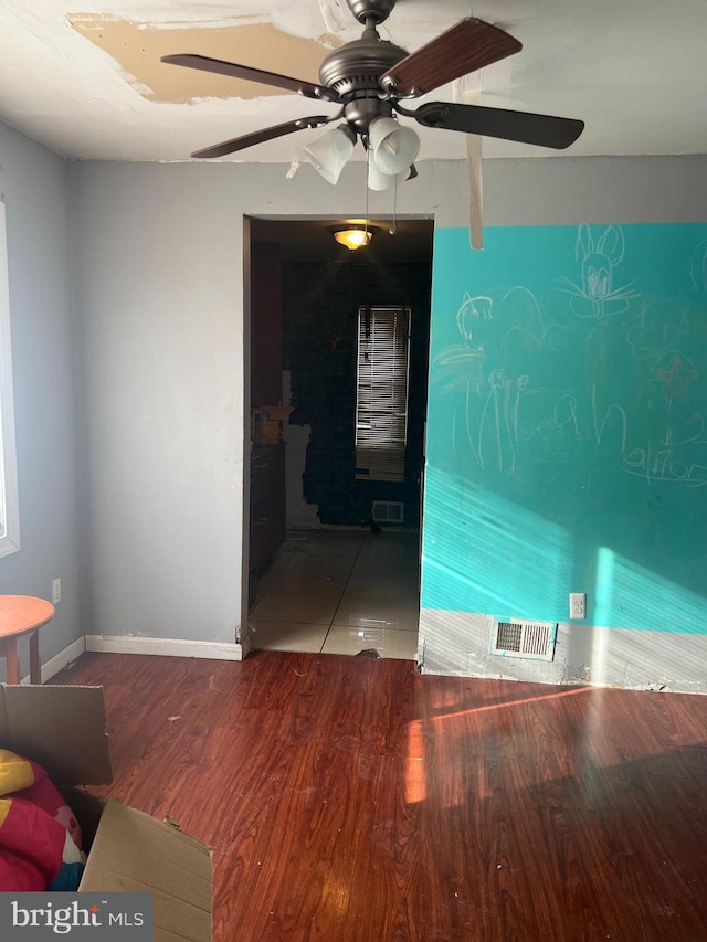 unfurnished room featuring hardwood / wood-style floors