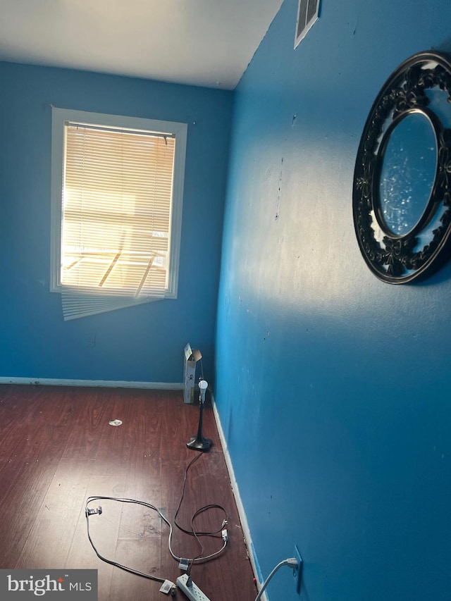 empty room featuring dark hardwood / wood-style floors