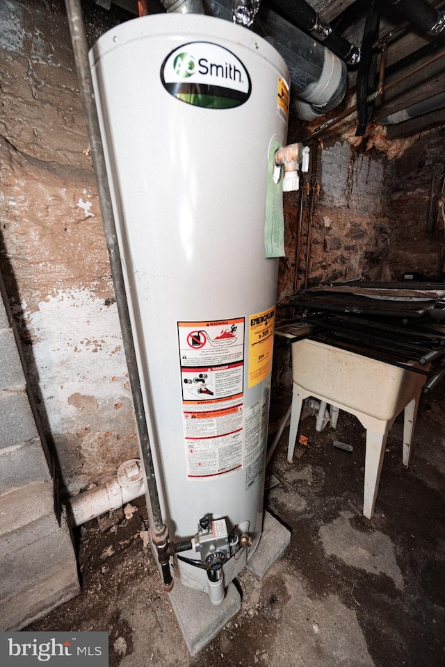 utility room featuring gas water heater