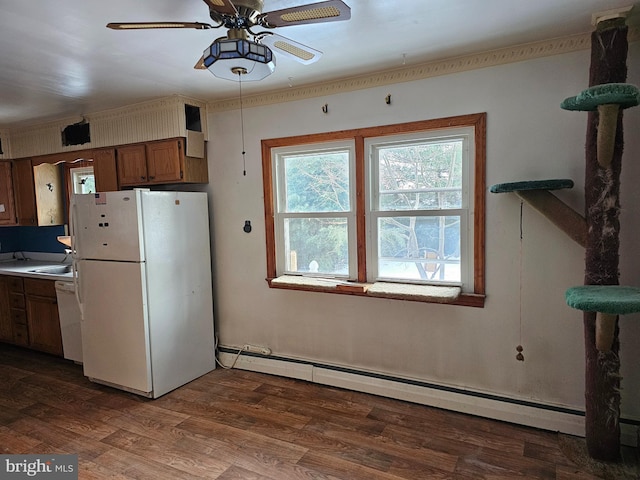 kitchen featuring ceiling fan, white appliances, wood-type flooring, and a baseboard radiator