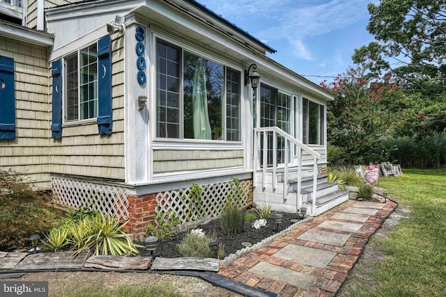 view of side of property with a lawn