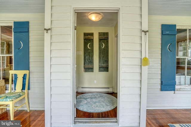 entrance to property featuring baseboard heating