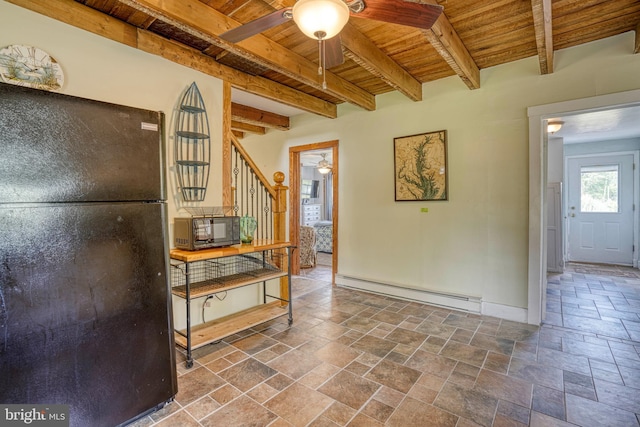 kitchen featuring black fridge, wooden ceiling, baseboard heating, beamed ceiling, and ceiling fan