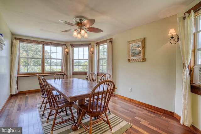 dining space featuring hardwood / wood-style floors and ceiling fan