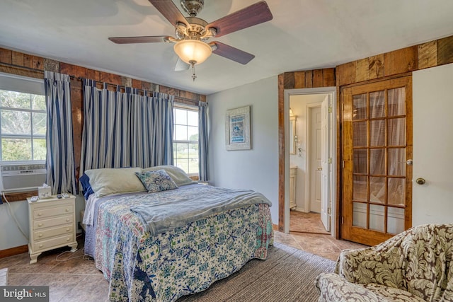 bedroom with cooling unit and ceiling fan