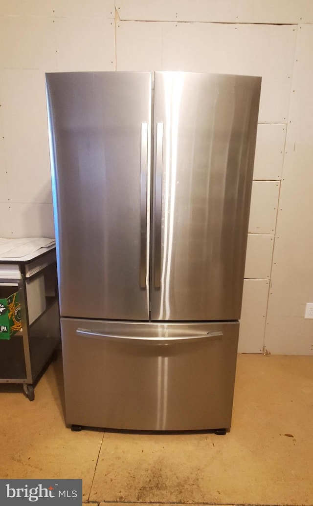 interior details featuring stainless steel fridge