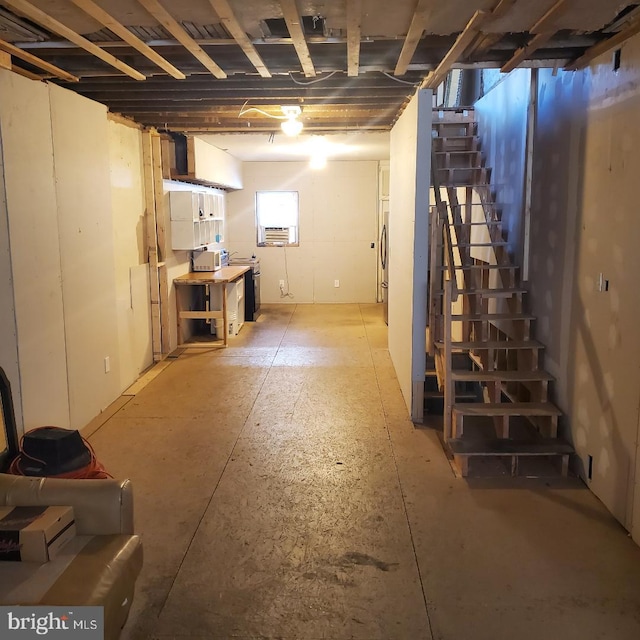 basement with stainless steel refrigerator