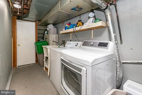 laundry area featuring washing machine and clothes dryer