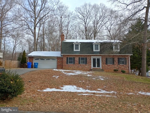 cape cod house with a garage