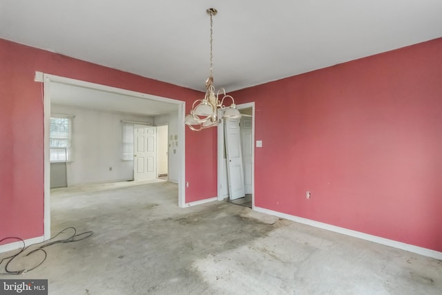 unfurnished dining area with an inviting chandelier