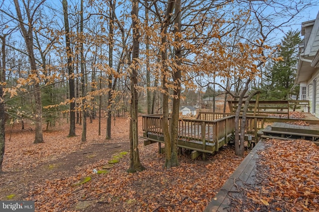 view of yard with a wooden deck