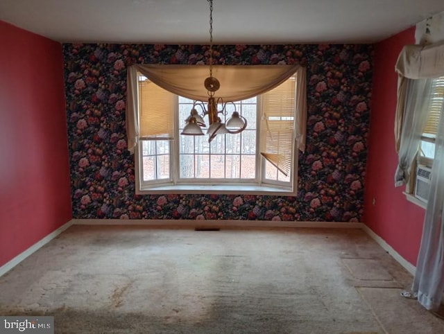 unfurnished dining area featuring carpet