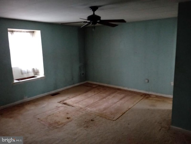 unfurnished room with ceiling fan