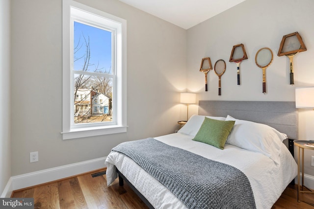 bedroom featuring dark hardwood / wood-style floors