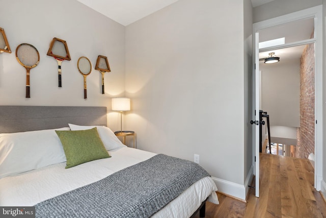 bedroom with hardwood / wood-style floors