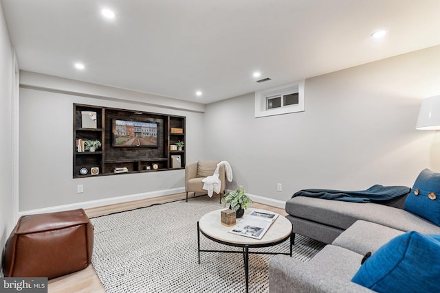 living room with light hardwood / wood-style floors